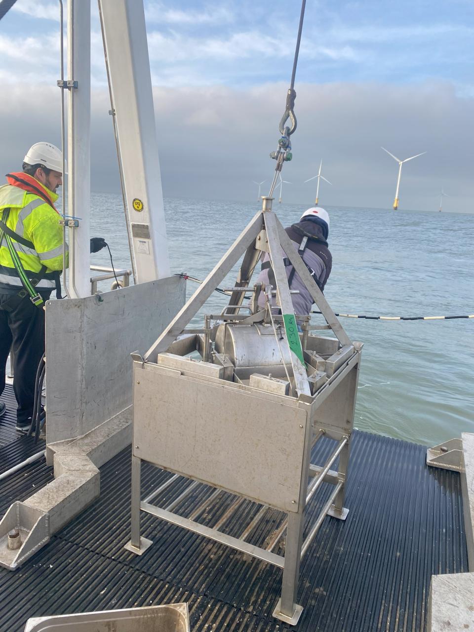 Two men at work on a ship