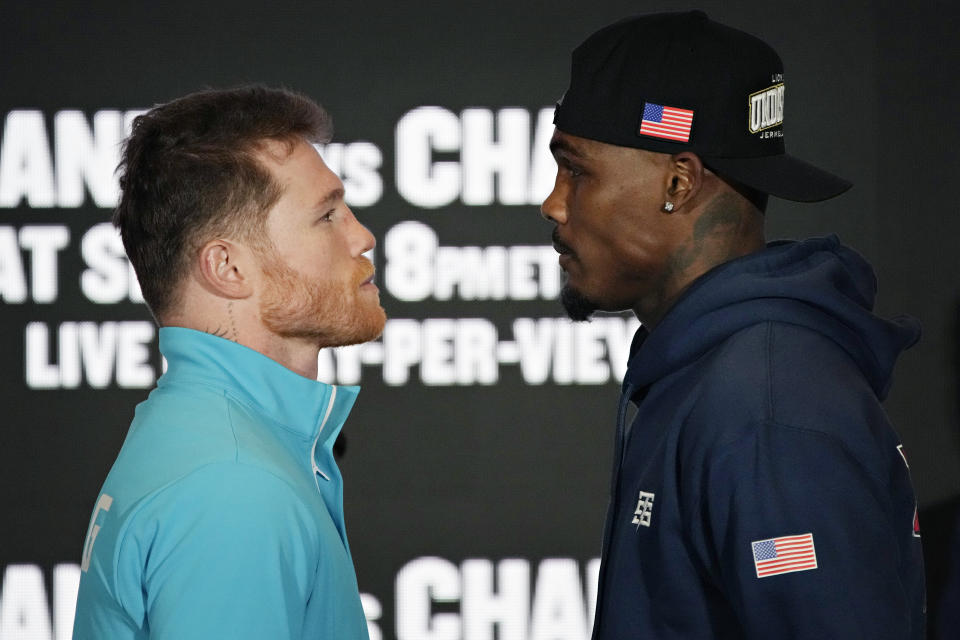 Canelo Alvarez, left, of Mexico, and Jermell Charlo pose during a news conference Wednesday, Sept. 27, 2023, in Las Vegas. The two are scheduled to fight in a super middleweight title boxing match Saturday in Las vegas. (AP Photo/John Locher)