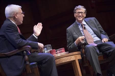 Campaign co-chair David M. Rubenstein (L) and William H. Gates speak during "The Opportunity to Make a Difference" discussion at Harvard University in Cambridge, Massachusetts in this September 21, 2013 handout provided by Harvard University. REUTERS/Kris Snibbe/Harvard Staff Photographer/Handout via Reuters