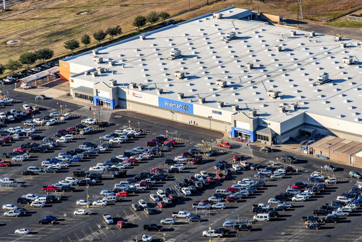 Houston, United States - December 10, 2018:  Aerial view of a crowded Walmart supermarket and parking lot in the suburban Houston, Texas region from an altitude of about 1000 feet.