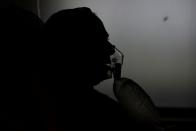 Medical workers treat patients infected with the coronavirus disease (COVID-19) at a hospital in New Delhi