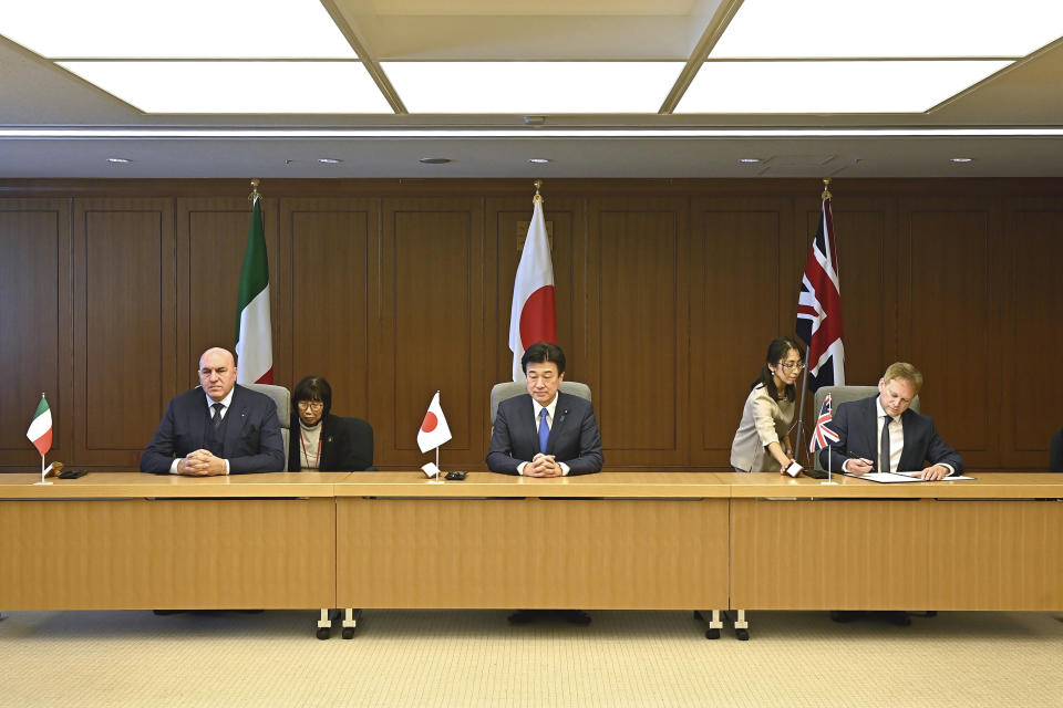 Britain's Defense Minister Grant Shapps, right, Italy's Defense Minister Guido Crosetto, left, and Japanese Defense Minister Minoru Kihara, center, attend a signing ceremony for Global Combat Air Programme (GCAP) at the defense ministry Thursday, Dec. 14, 2023, in Tokyo, Japan. (David Mareuil/Pool Photo via AP)