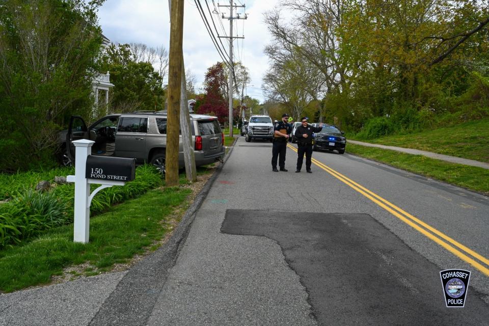 Cohasset police block Pond Street, where an SUV finally came to a stop after rolling out of control through a crowded soccer field at Cohasset Middle School.