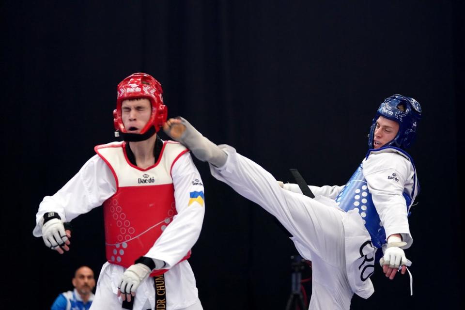 Croatia’s Marko Golubic, right, in action against Ukraine’s Oleksandr Chumachenko during day four of the European Taekwondo Championships at the Manchester Regional Arena (Zac Goodwin/PA) (PA Wire)