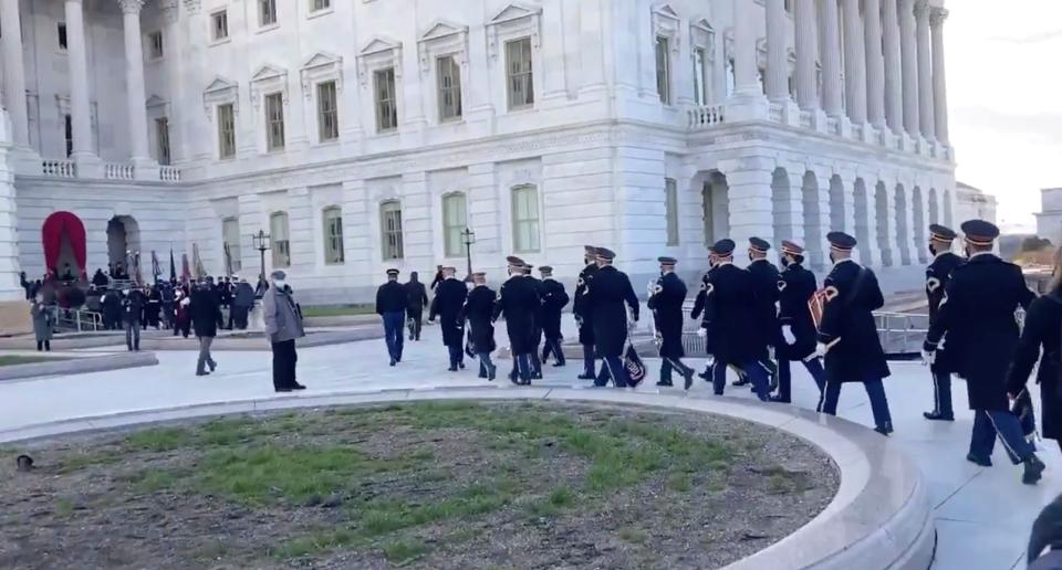 Personnel evacuate the West front of Capitol being evacuated for an “external security threat”