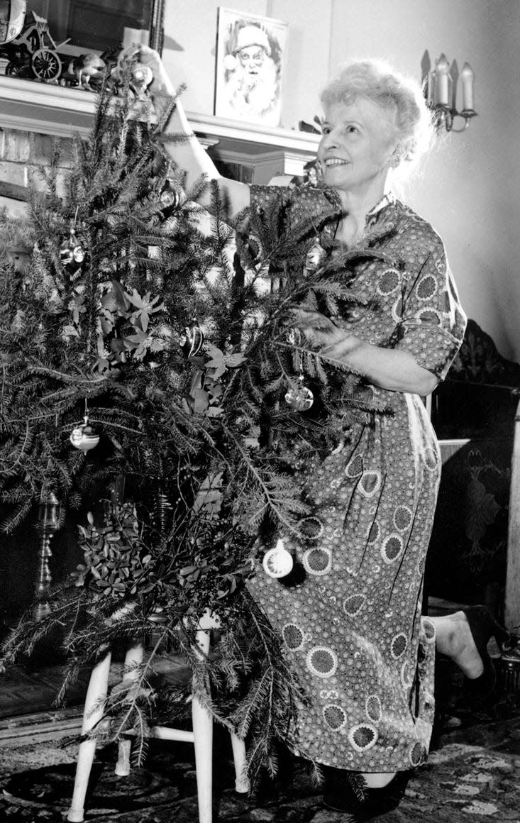 Virginia Douglas, principal of P.S. 31 in lower Manhattan, decorates her Christmas tree Dec. 15, 1951, in New York.  When she was 8, the former Virginia O'Hanlon wrote a letter to the New York Sun asking, "Please tell me the truth, is there a Santa Claus?" Her letter evoked the famous Santa Claus editorial in 1897, which said, "Yes, there is a Santa Claus. He exists as certainly as love and generosity and devotion exist."