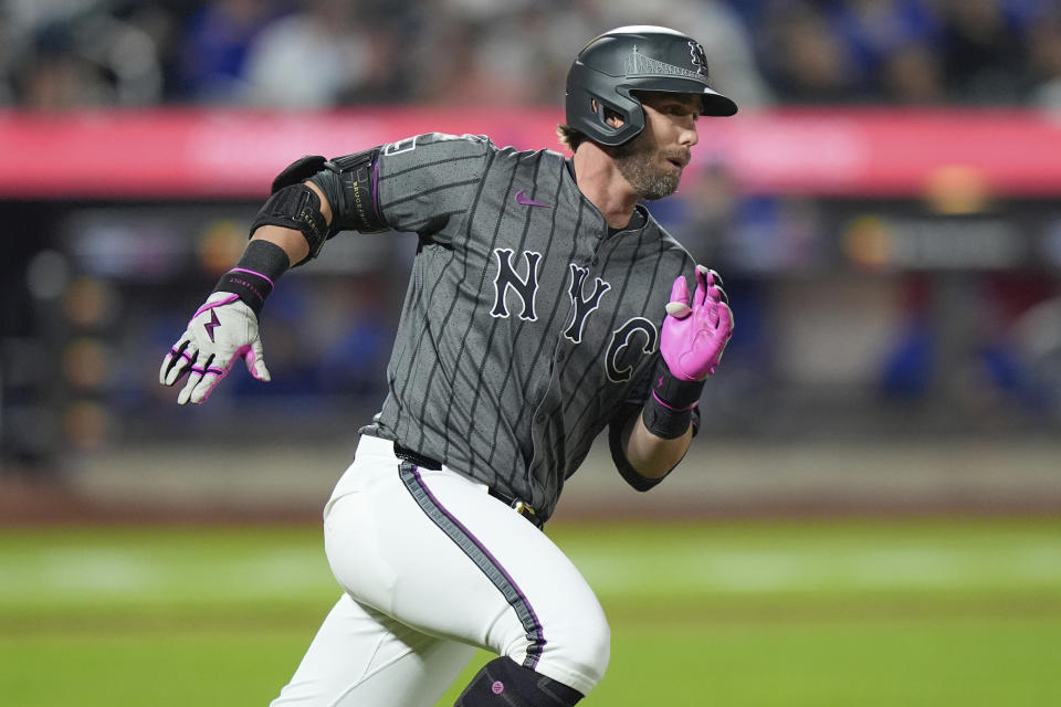 New York Mets' Jeff McNeil runs to first base for a single during the seventh inning of a baseball game against the Chicago Cubs, Monday, April 29, 2024, in New York. (AP Photo/Frank Franklin II)