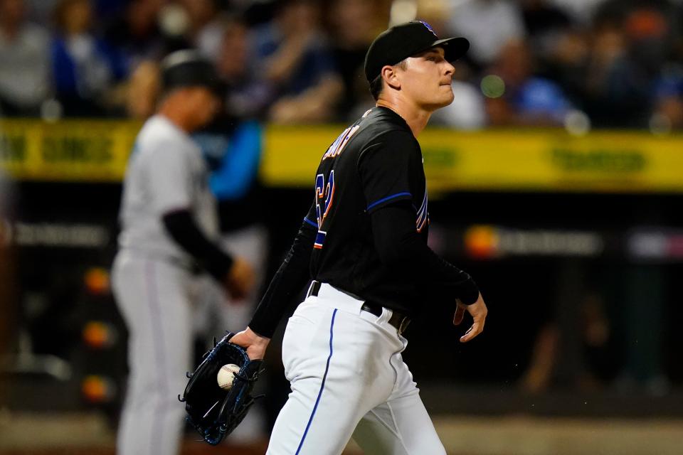 New York Mets relief pitcher Drew Smith reacts after Miami Marlins' Garrett Cooper hit a two-run home run during the eighth inning of a baseball game Friday, July 8, 2022, in New York. (AP Photo/Frank Franklin II)