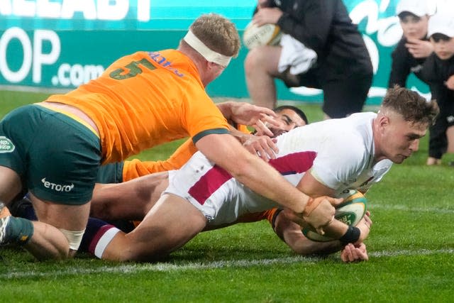 England’s Freddie Steward scores a try as Australia’s Matt Philip attempts the tackle 