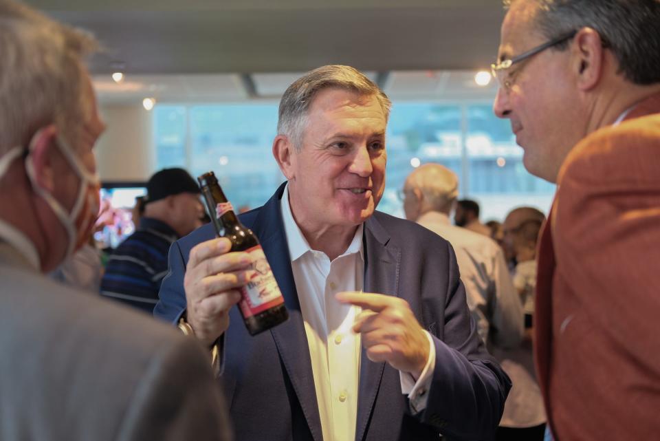 Oak View Group CEO Tim Leiweke, center, and Brown Distributing announced a partnership for the new Moody Center in May. This week, Anheuser-Busch struck a deal with Texas athletics to be the new distributor for Longhorns athletic events.