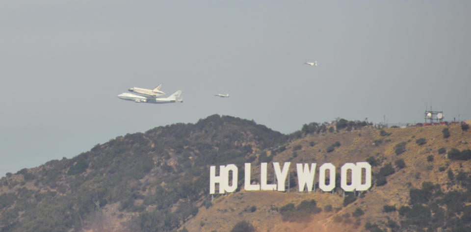 The Endeavour passes over the Griffith Observatory in Los Angeles. Courtesy of Wayne Chan.