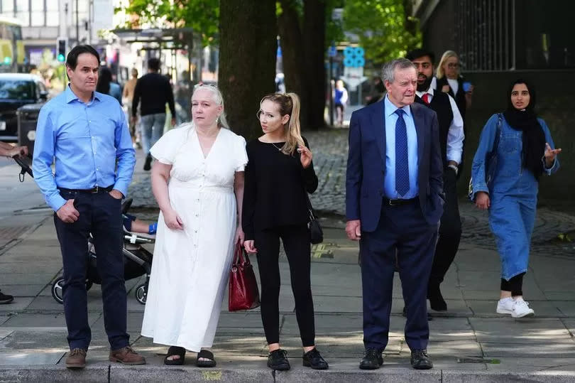 Paula Leeson's brother Neville Leeson (left) and father Willy Leeson (right) outside Manchester Civil Justice Centre -Credit:PA