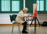 A woman attends the Polish regional elections, at a polling station in Warsaw, Poland, October 21, 2018. REUTERS/Kacper Pempel