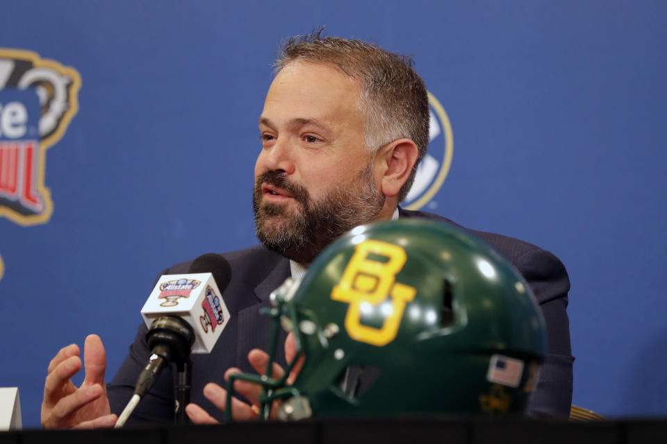 FILE - In this Dec. 31, 2019, file photo, Baylor head coach Matt Rhule talks to reporters during a Sugar Bowl NCAA college news conference in New Orleans. A person familiar with the situation says the Carolina Panthers are completing a contract to hire Baylor's Matt Rhule as their coach. The person spoke to The Associated Press on Tuesday, Jan. 7, 2020, on condition of anonymity because the deal is not done. The Panthers have not spoken publicly about the coaching search. (AP Photo/Gerald Herbert, File)