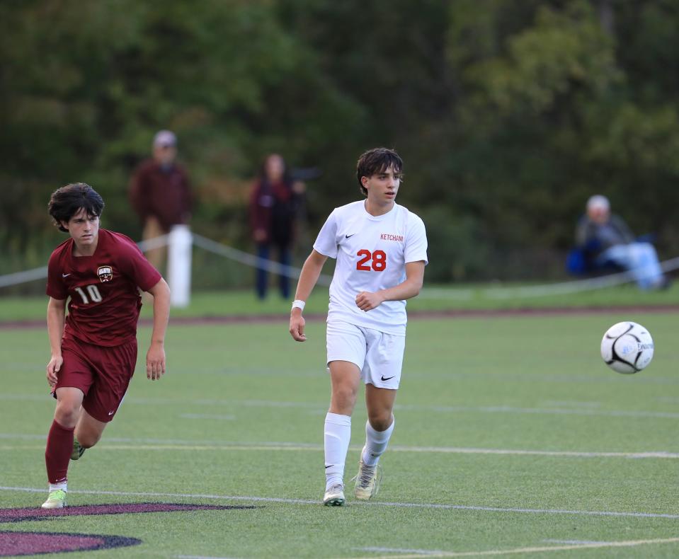 Arlington's Ned Devendorf (left) and Ketcham's Victor Chacon pursue a loose ball during a Sept. 29, 2022 boys soccer game.