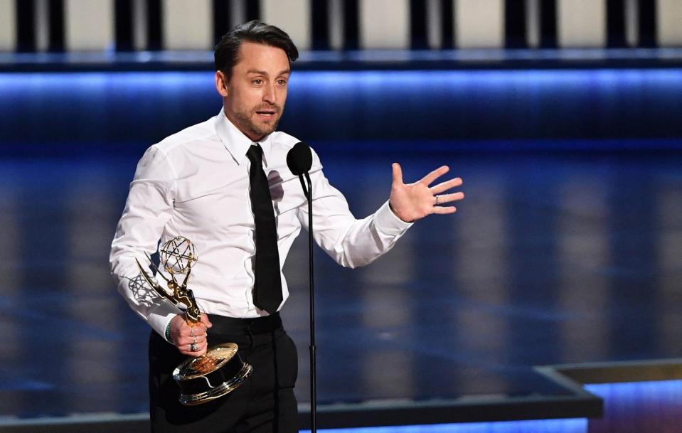 kieran culkin on stage with his emmy award for best actor in a drama series for succession