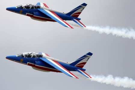 French Air Force Patrouille de France teams are seen during a training, on the eve of the opening of the 53rd International Paris Air Show at Le Bourget Airport near Paris