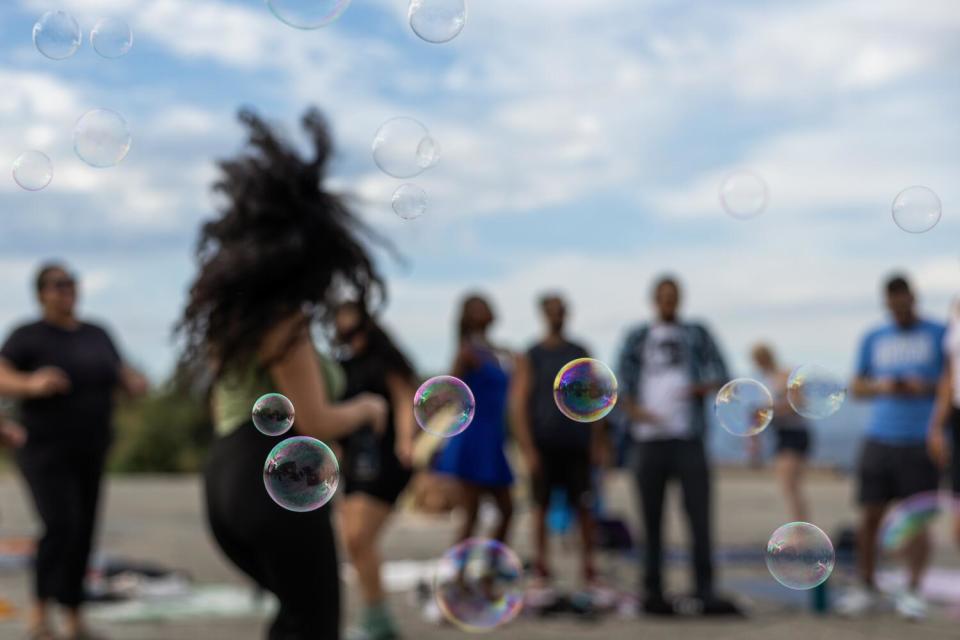 Participants dance at sunset during the Natural High alcohol-free party at Elysian Park.