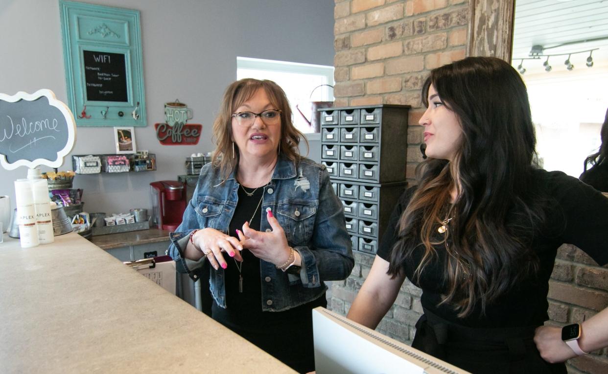 Krystal McLeod, left, and Nicole Bolis, owners of East Main Salon shown Wednesday, May 4, 2022, talk about taking over the Brighton salon from its previous owner.