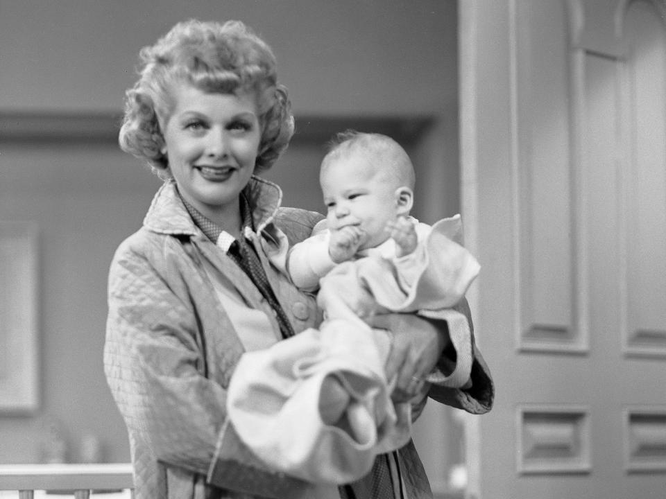 Lucille Ball holding baby Richard Lee Simmons