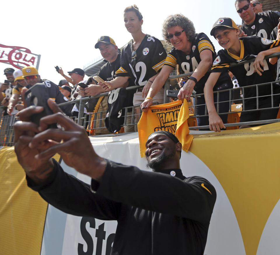 Pittsburgh Steelers fans and Le’Veon Bell, in less stressful times. (AP Photo/Keith Srakocic)