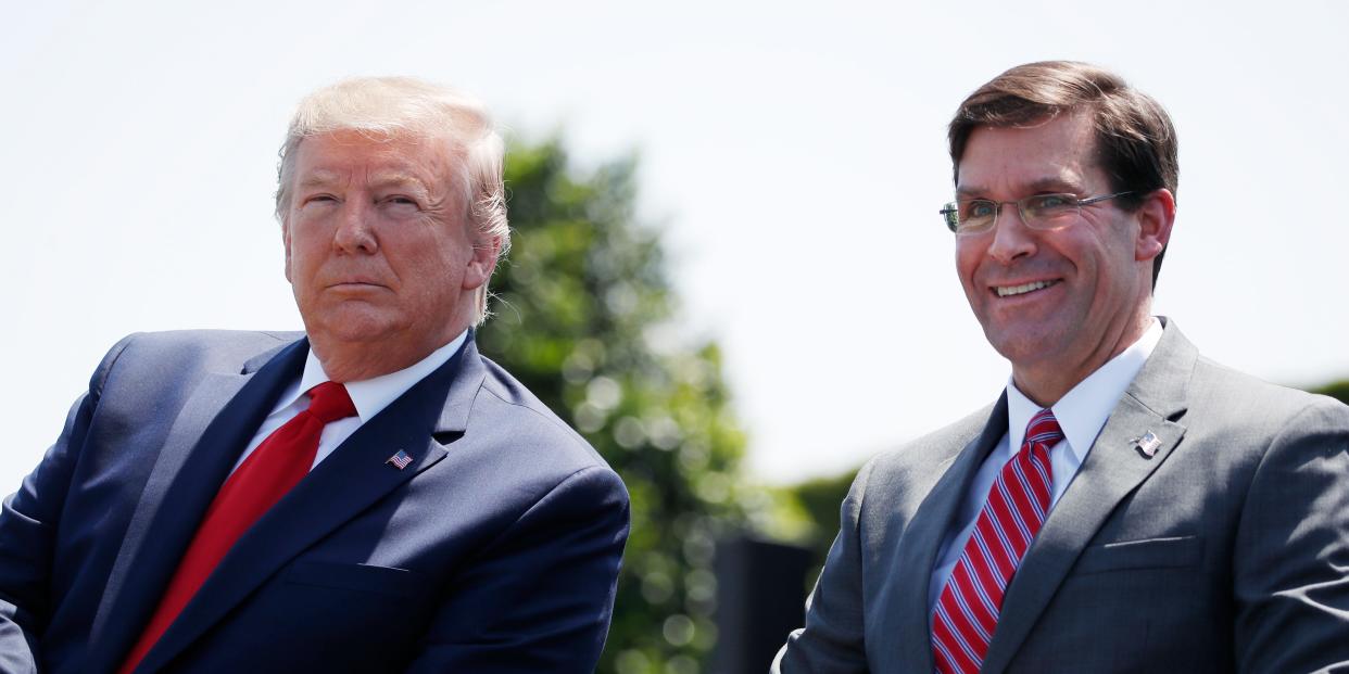 President Donald Trump, left, sits with Secretary of Defense Mark Esper, during a full honors welcoming ceremony for Esper at the Pentagon, Thursday, July 25, 2019, in Washington.