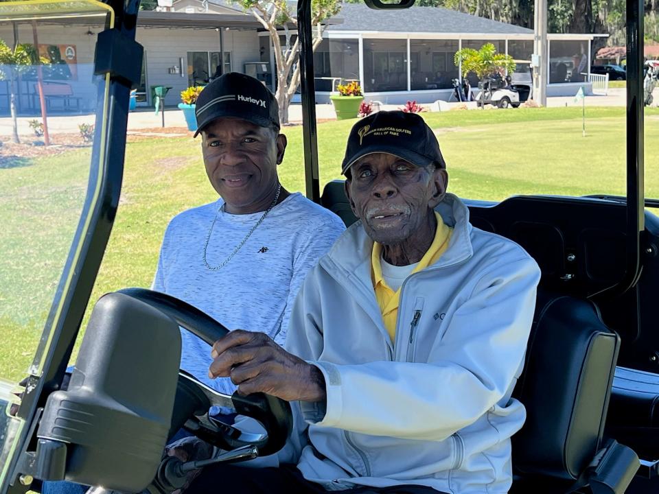 Herbert Dixon (right), the namesake for the 11th annual Herbert Dixon Celebrity Golf Tournament, at the event with Samuel Dixon on Saturday.