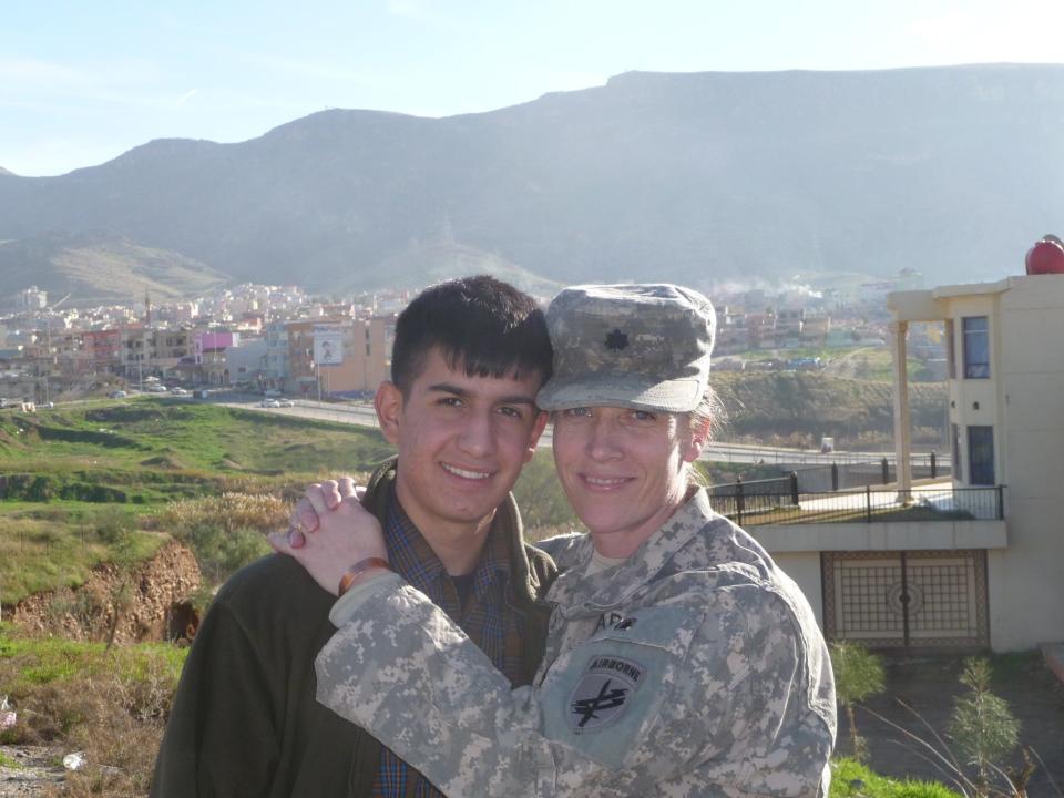 Ravand Al Dosaki, 16, and Col. Mary Prophit in January 2010, the last time the two would see each other in Iraq. Weeks later, Prophit returned to the U.S. after what would be her last overseas deployment before she retired from the U.S. Army. Prophit often refers to Dosaki as "my Kurdish son" and once considered adopting him