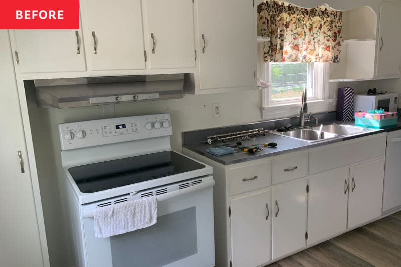 Outdated white kitchen before renovation