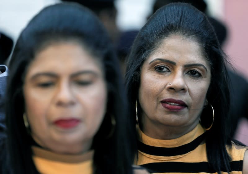 Lakshika and Devika (55), are pictured during an event to attempt to break the world record for the biggest gathering of twins in Colombo