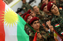 <p>Iraqi Kurdish peshmerga soldiers take part in a gathering on Sept. 20, 2017, to urge people to vote in the upcoming independence referendum in Arbil, the capital of the autonomous Kurdish region of northern Iraq. (Photo: Safin Hamed/AFP/Getty Images) </p>