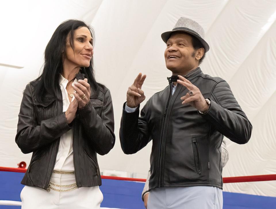 Legendary local boxer Ronnie Harris is accompanied by his wife, Elaine, Saturday night during an intermission ceremony at the Brawl at the Hall of Fame Village. Harris is a Canton native and 1968 lightweight Olympic boxing gold medalist.