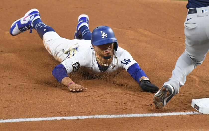 ARLINGTON, TEXAS OCTOBER 20, 2020-Dodgers Mookie Betts steals 3rd base against the Rays in the 5th inning in Game 1 of the World Series at Globe Life Field in Arlington, Texas Tuesday. (Wally Skalij/Los Angeles Times)