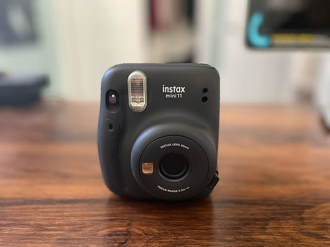 Instax mini 11 photo phone printer on desk