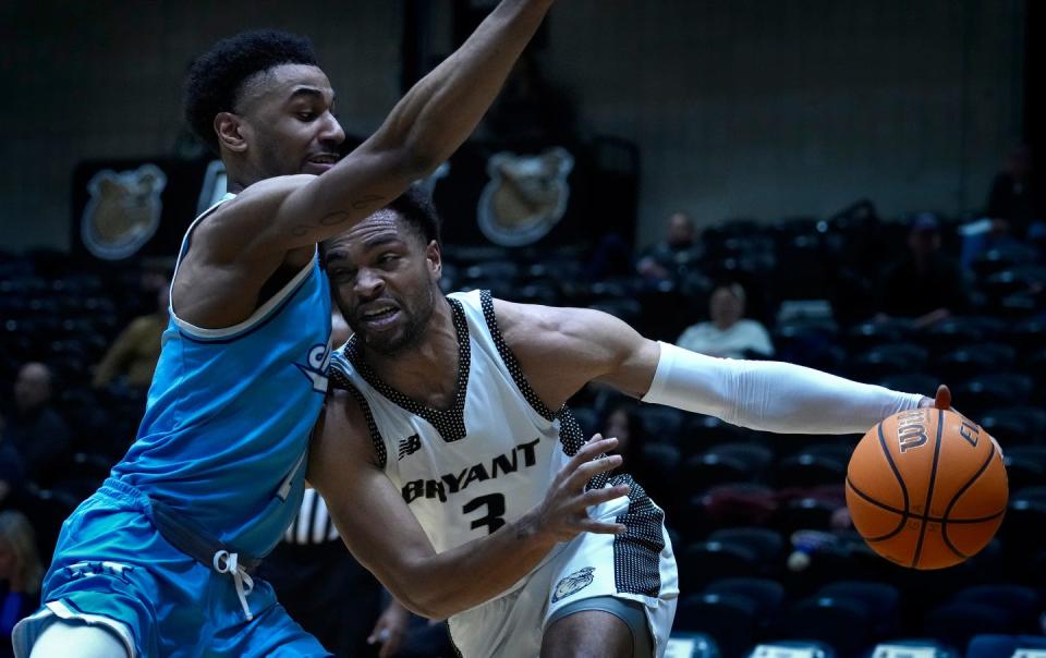 Bryant guard Sherif Gross-Bullock moves into Maine defender Kellen Tynes on his way to the hoop for the Bulldogs in the first half Thursday.