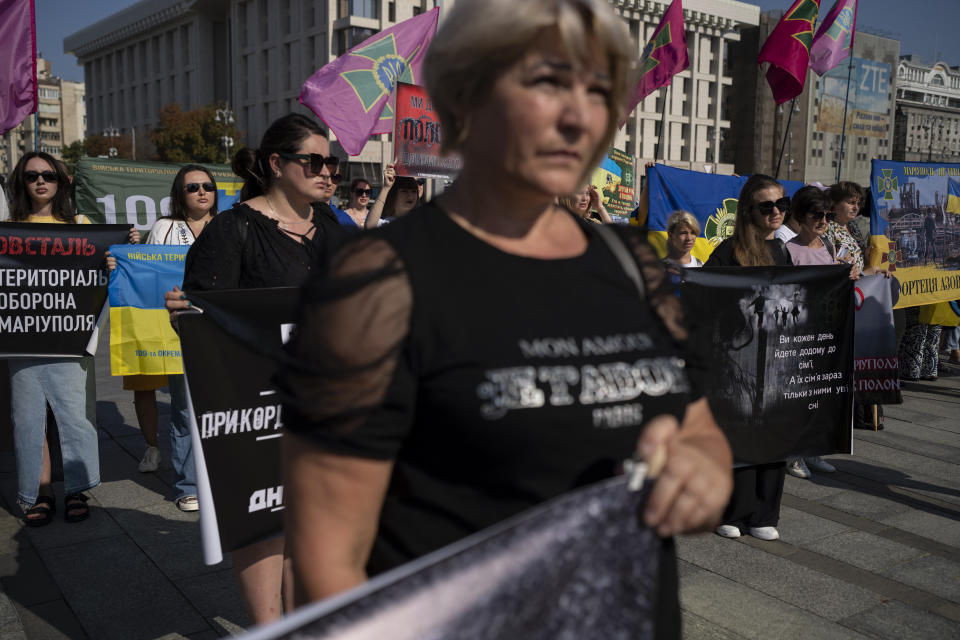 People gather for a protest calling for the release of Ukrainian soldiers captured by Russians at the Independence Square in Kyiv, Ukraine, Sunday, Aug. 27, 2023. The protest marks five hundred days since the soldiers were captured in the besieged city of Mariupol. (AP Photo/Bram Janssen)