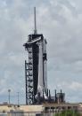 The SpaceX Crew Dragon spacecraft sits atop a Falcon 9 booster rocket on Pad39A