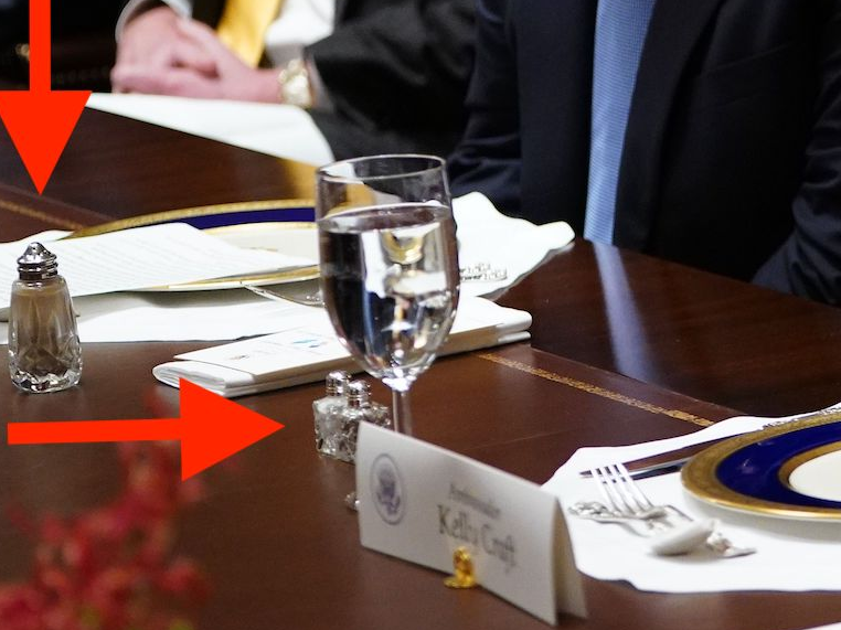 US President Donald Trump listens as US Representative to the UN Kelly Craft speaks during a luncheon with the UN Security Council permanent representatives in the Cabinet Room of the White House in Washington, DC, on December 5, 2019.