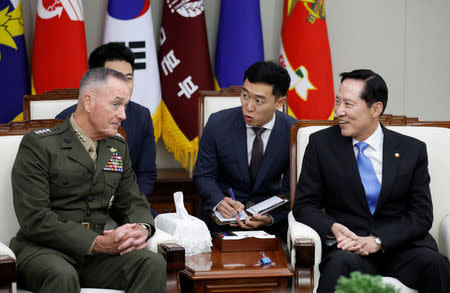 U.S. Chairman of the Joint Chiefs of Staff Gen. Joseph Dunford talks with South Korean Defence Minister Song Young-moo during their meeting at the Defence Ministry in Seoul, South Korea, August 14, 2017. REUTERS/Kim Hong-Ji