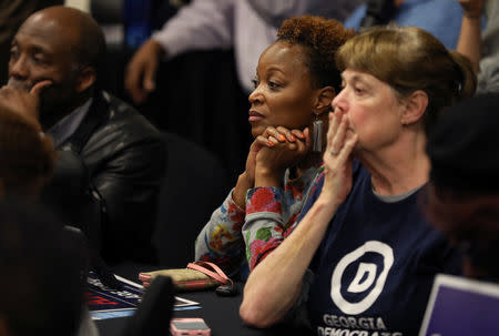 Supporters listen closely to Stacey Abrams, the Democratic gubernatorial candidate for Georgia, ahead of the midterm elections, in Fayetteville, Georgia, U.S. October 25, 2018. REUTERS/Lawrence Bryant