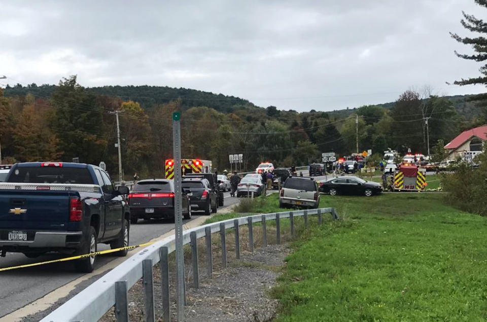 In this Saturday, Oct. 6, 2018 photo, emergency personnel respond to the scene of a deadly crash in Schoharie, N.Y. (WTEN via AP)