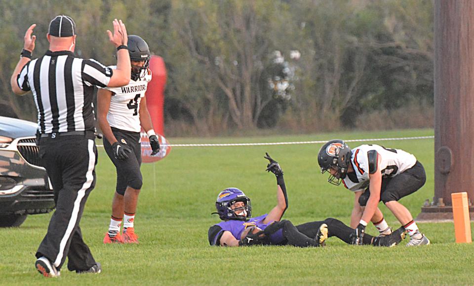 Watertown receiver Nathan Briggs signals after making a diving touchdown catch against Sioux Falls Washington's Hayden Schilling (4) and Nathan Day (20) during Watertown High School's homecoming football game on Friday, Sept. 15, 2023 at Watertown Stadium.