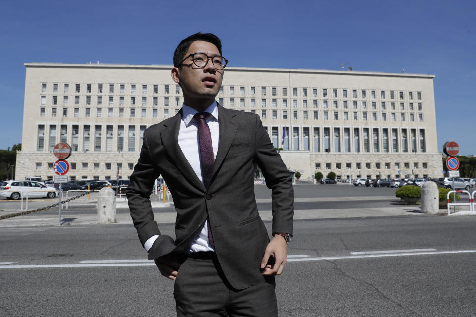 FILE - Hong Kong activist Nathan Law takes part in a protest during a meeting of Chinese Foreign Minister Wang Yi with Italian Foreign Minister Luigi Di Maio, in Rome, Tuesday, Aug. 25, 2020. Hong Kong police on Monday, July 3, 2023, accused eight self-exiled pro-democracy activists, including Nathan Law, of violating the territory's tough National Security Law and offered rewards of 1 million Hong Kong dollars ($127,600) each for information leading to their arrests. (AP Photo/Andrew Medichini, File)