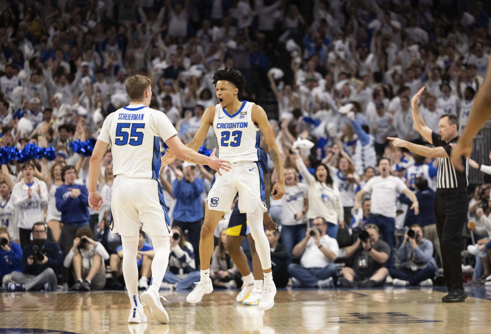 Creighton's Trey Alexander (23) celebrates with Baylor Scheierman (55) after making a three point shot against Marquette during the first half of an NCAA college basketball game Saturday, March 2, 2024, in Omaha, Neb. (AP Photo/Rebecca S. Gratz)