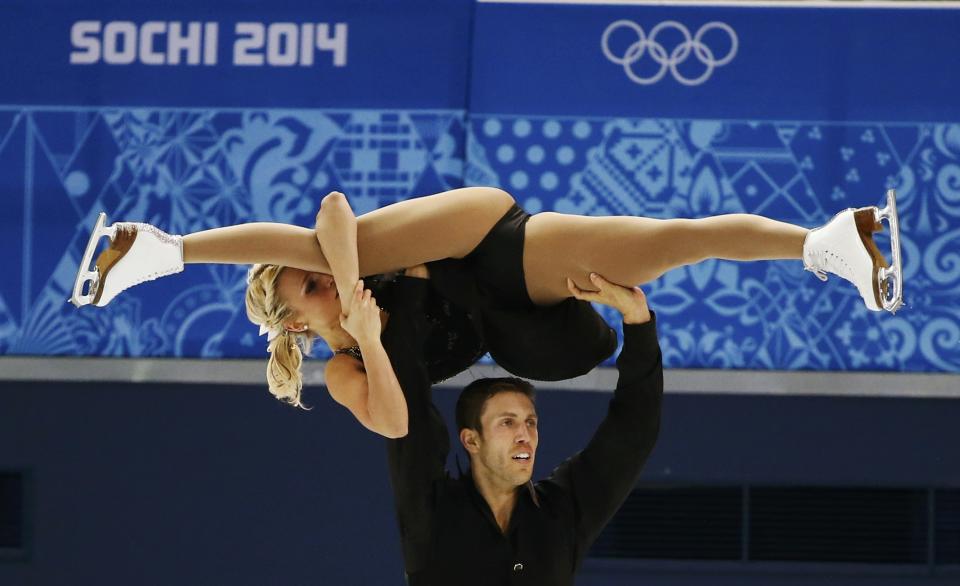 Kirsten Moore-Towers and Dylan Moscovitch of Canada compete during the Team Pairs Free Skating Program at the Sochi 2014 Winter Olympics, February 8, 2014. REUTERS/Lucy Nicholson (RUSSIA - Tags: SPORT FIGURE SKATING SPORT OLYMPICS)