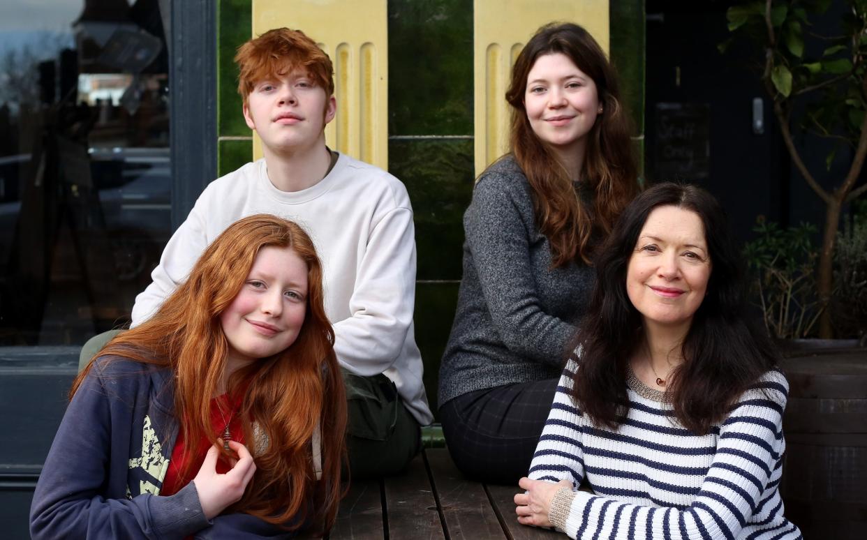 MayKa0003047. The Daily Telegraph. Portrait of Oonagh Shiel and her three children Thomas, 16, Caitlin, 20 (brown hair) and Julia, 14, (red hair), photographed near their home in Muswell Hill, north London, for a Your Money case study on investing into ISAs for children. Saturday February 25, 2023. - Clara Molden