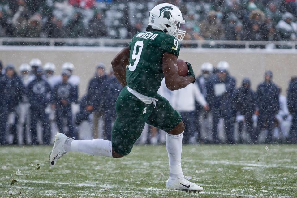 Nov 27, 2021; East Lansing, Michigan, USA; Michigan State Spartans running back Kenneth Walker III (9) runs the ball during the first quarter against the Penn State Nittany Lions at Spartan Stadium. Mandatory Credit: Raj Mehta-USA TODAY Sports