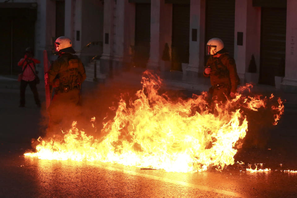 A petrol bomb explodes in front of policemen during clashes in Athens, May 8, 2016. Protesters in Greece have hurled firebombs and other projectiles at police in front of parliament before a controversial vote on an austerity bill. (Yorgos Karahalis/AP)