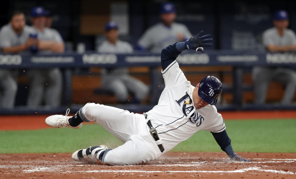 ST. PETERSBURG, FL - MAY 28: Avisail Garcia #24 of the Tampa Bay Rays slides in with an inside-the-park home run in the third inning of a baseball game against the Toronto Blue Jays at Tropicana Field on May 28, 2019 in St. Petersburg, Florida. (Photo by Mike Carlson/Getty Images)