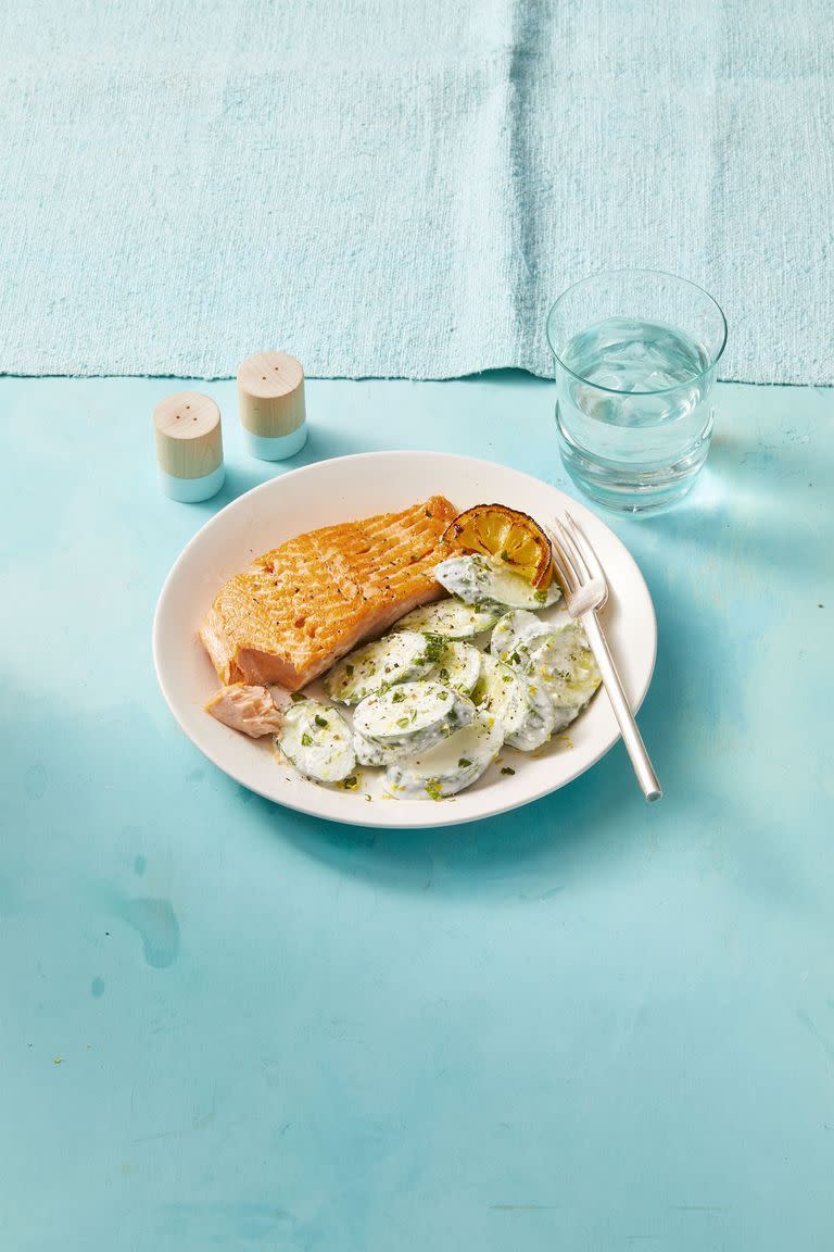 heart healthy recipes salmon with creamy feta cucumbers on blue table